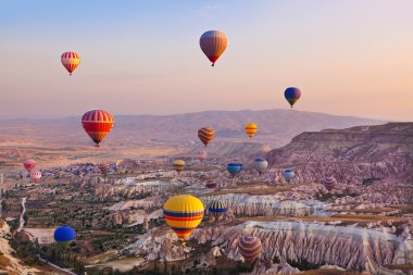 Hot air balloon flying over Cappadocia Turkey clipart