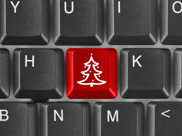 Teclado de computador com chave de árvore de Natal — Fotografia de Stock