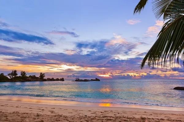 Seychelles tropical beach at sunset Stock Photo