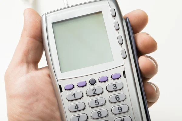 The modern bank terminal in a man's hand — Stock Photo, Image