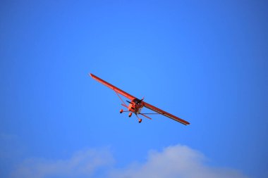 Small private propeller plane flies in the sky