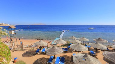 Sharm El Sheikh, Egypt - 02 february, 2017: Beach with sun loungers and parasols in Sharm El Sheikh in Egypt