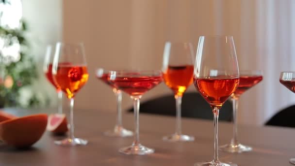 Red Alcoholic Drinks Glasses Table Grapefruit — Stockvideo