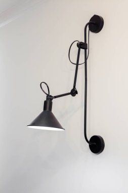 Modern black light lamp on the wall