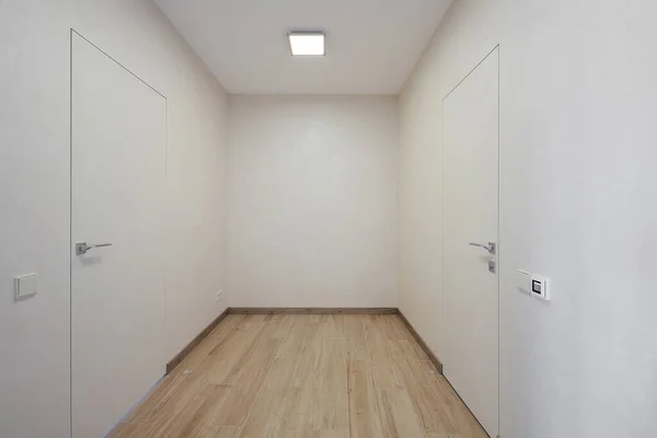 White corridor in a modern apartment interior