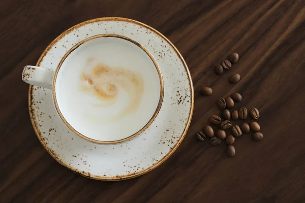 Cup Cappuccino Coffee Beans Wooden Table Top View — Fotografia de Stock