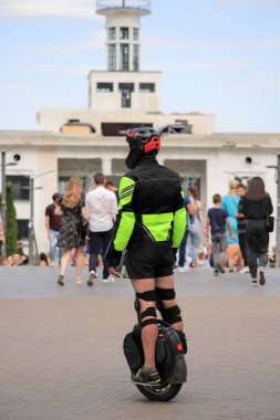 Kyiv, Ukraine - 24 august, 2021: Rider in equipment on an electric unicycle