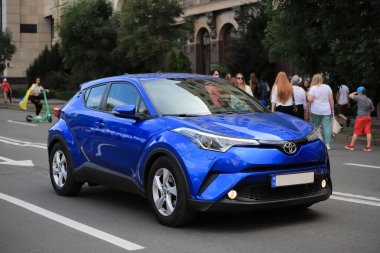 Kyiv, Ukraine - 24 august, 2021: New car blue Toyota C-HR on the road