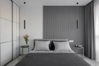 Double bed in a modern bedroom interior