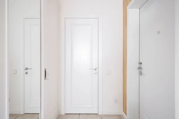 White interior door in the apartment