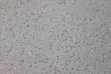 Gri kuvars taşından bir tezgahın dokusu. 
