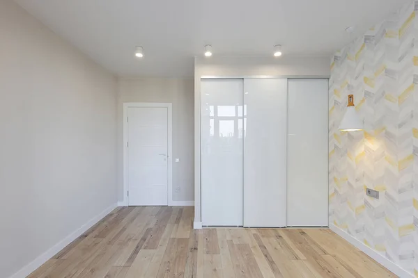 Empty new bedroom with sliding wardrobe