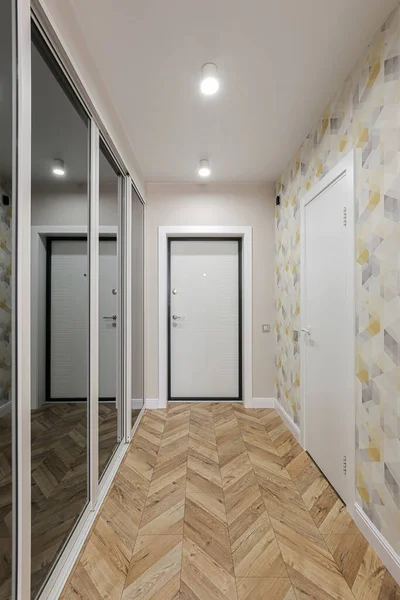 Corridor in the interior of the apartment with sliding wardrobe