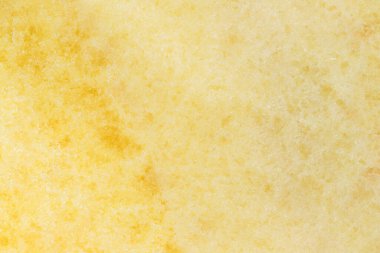 Sarı taştan bir tezgahın dokusu. Yakın plan. 