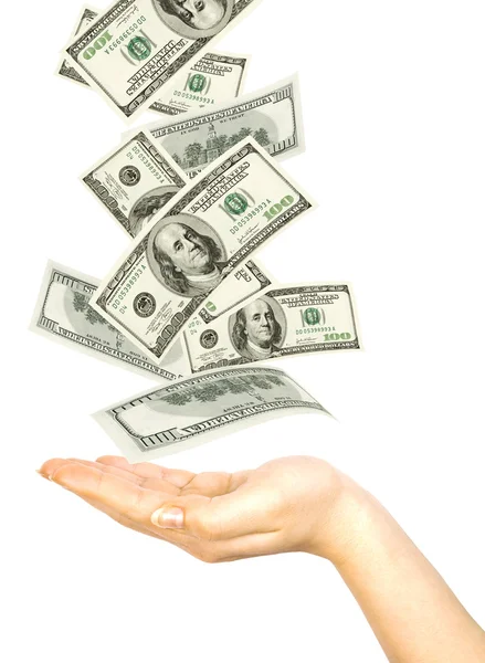 Dollars falling on womans hand — Stock Photo, Image