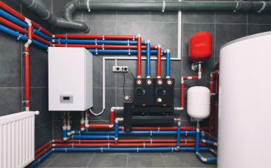 A modern electic boiler room. Equipment for modern heating system as a boiler, heater,pipes, expansion tank and other