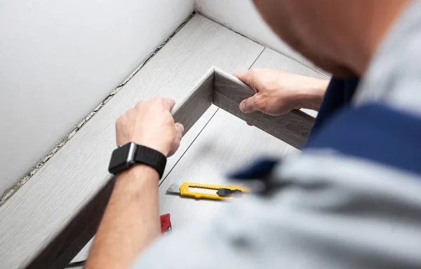 Worker Finishing Floor Installation Installing Skirting Board — Stock Fotó