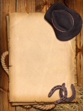 Western background with cowboy hat and horseshoe. clipart