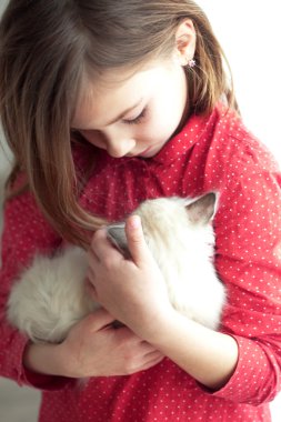 Child and kitten