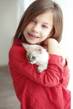 Child and kitten