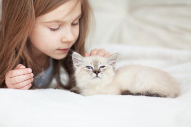 Child and kitten
