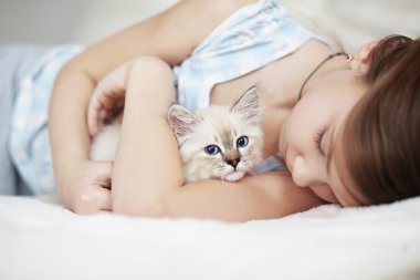 Child and kitten