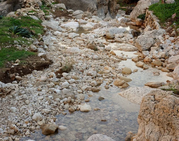 Pebble scree in a small mountain creek — Stock Photo, Image