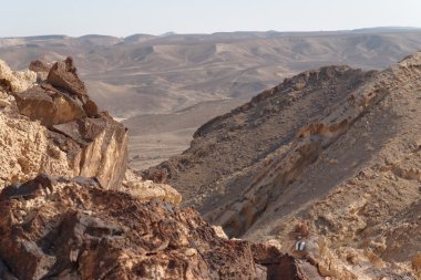 Jagged rocks on the edge of the cliff in the desert