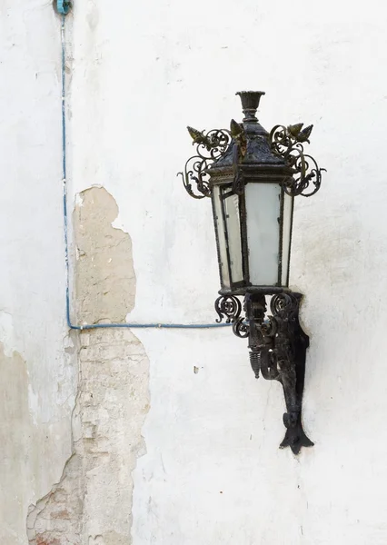 Retro street lantern on peeling plaster wall — Stock Photo, Image