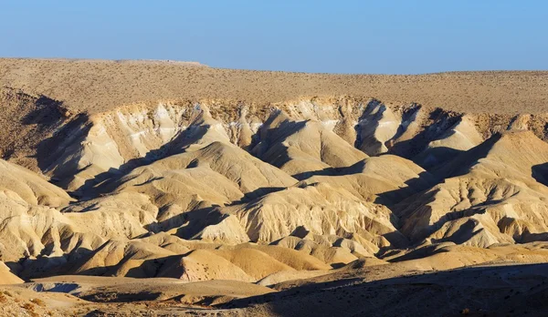 Dunas amarelas texturizadas no deserto ao pôr do sol — Fotografia de Stock