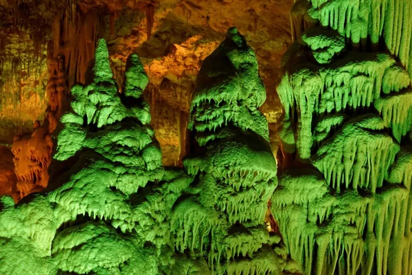 Strange green-lit stalagmite shapes in Soreq Cave, Israel — Stock Photo, Image