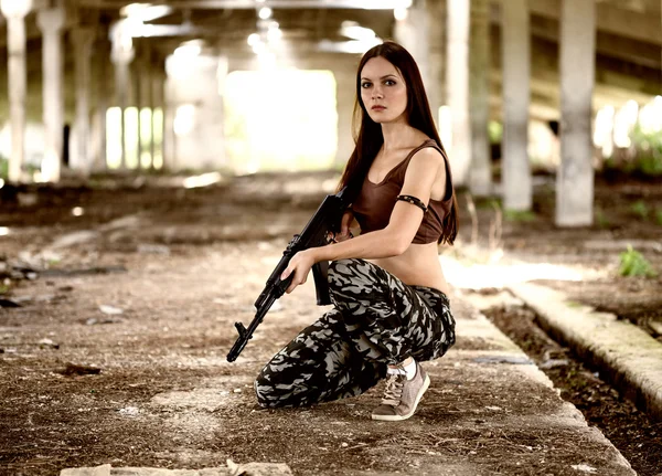 A military woman with an automatic rifle ak-74 — Stok fotoğraf