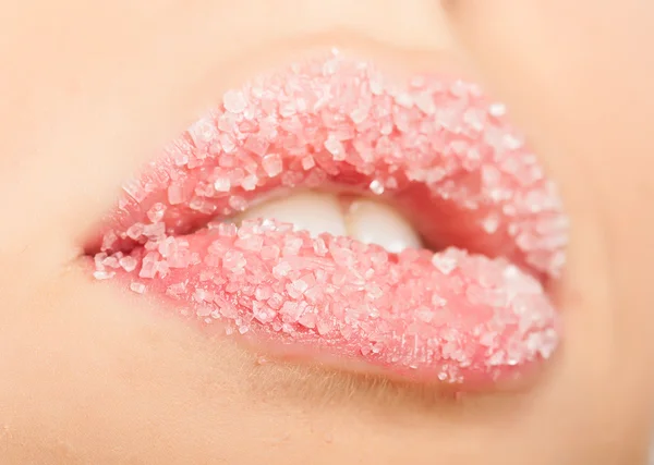 Woman's red lips strewed with sugar — Stock Photo, Image