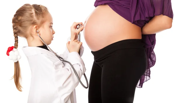 A cute girl is listening to her mother — Stock Photo, Image