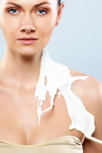 Woman in milk sprays — Stock Photo, Image