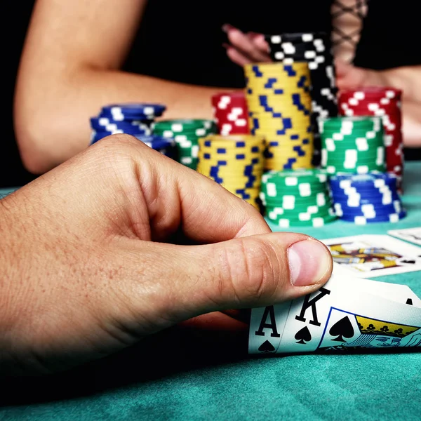 Man looking  on playing cards — Stock Photo, Image