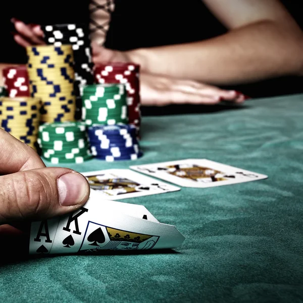 Man looking  on playing cards — Stock Photo, Image