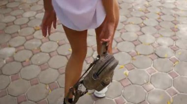 Beautiful sexy girl walks on a tropical island. Real lifestyle handheld shots