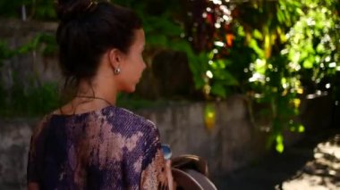 Follow me footage of a girl dressed in Asian style.