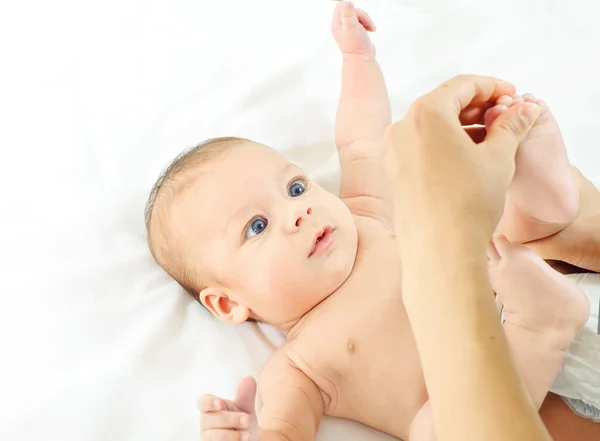 Masseur massaging little baby's feet — Stock Photo, Image