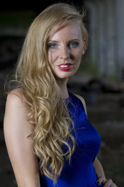 Woman in blue cocktail dress — Stock Photo, Image