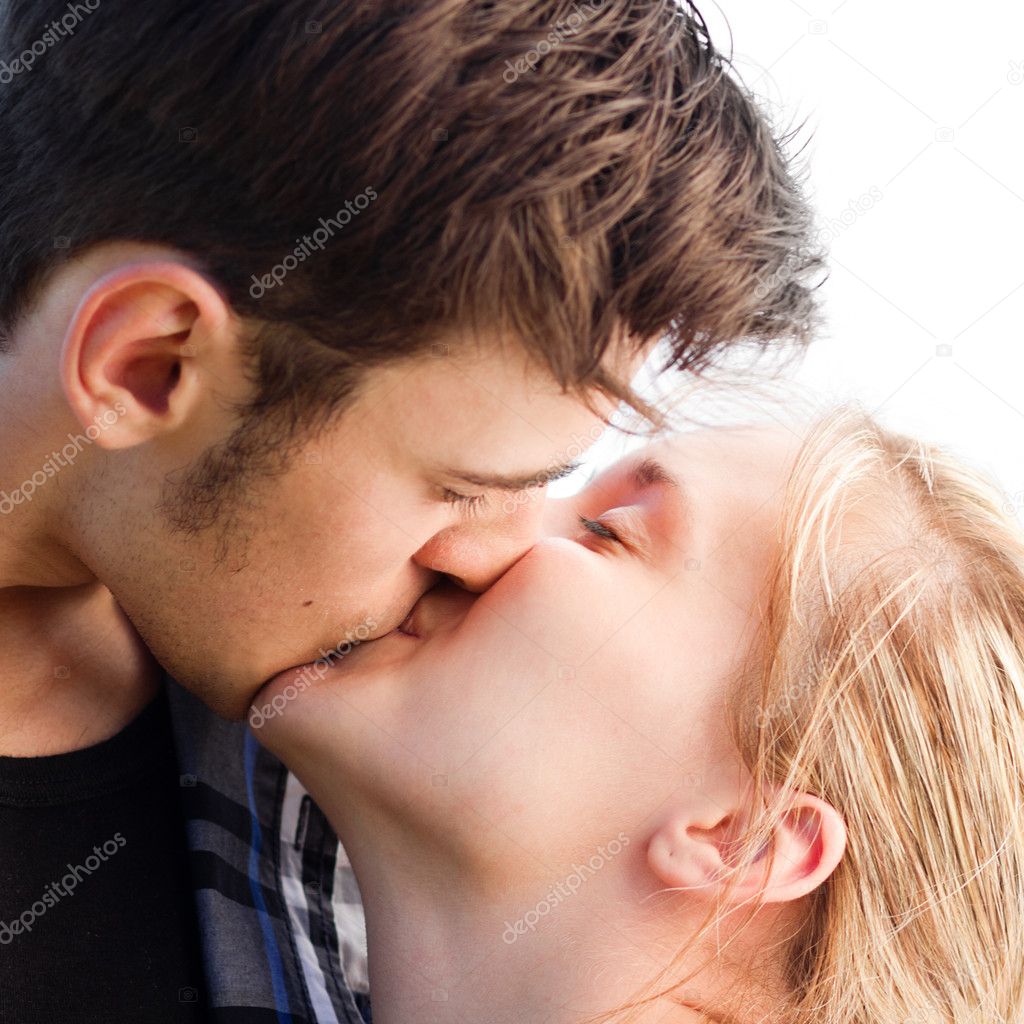 Young romantic couple kissing