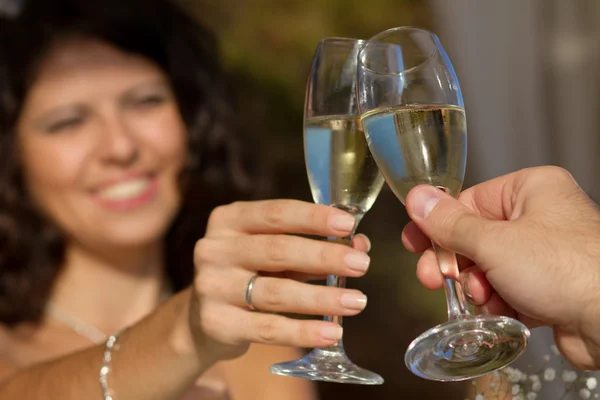 Young couple raising wedding toast — Stock Photo, Image