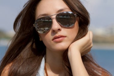 Cool young girl in sunglasses