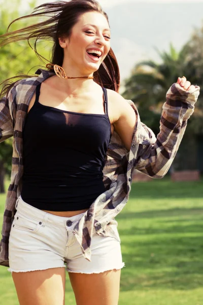 Beautiful young greek girl in park — Stock Photo, Image