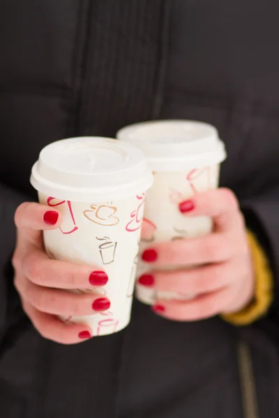 Girl holding coffee cups — Stock Photo, Image