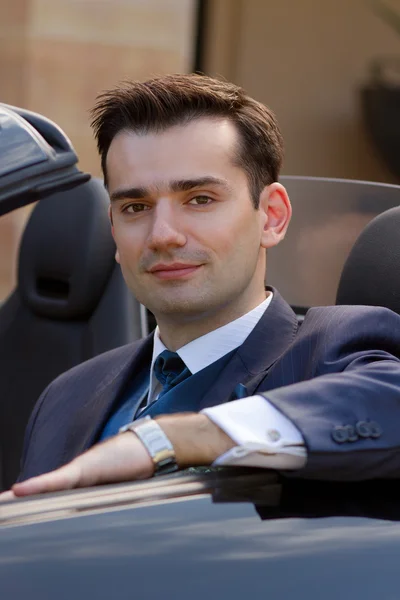 Handsome businessman in cabrio — Stock Photo, Image