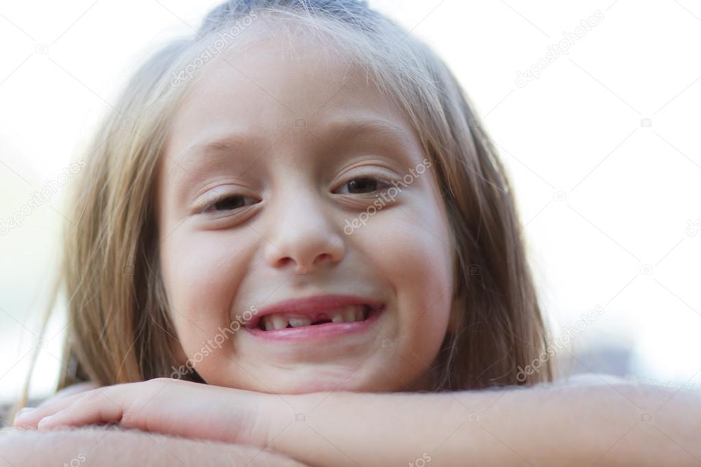 Funny toothless little girl