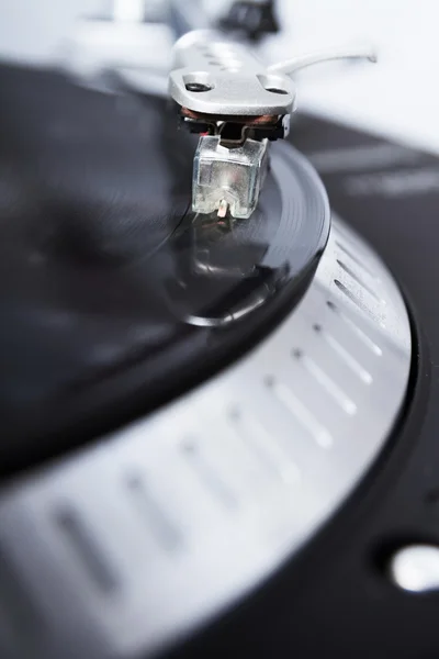 Turntable playing vinyl record with music — Stock Photo, Image