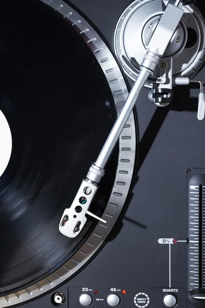 Turntable playing vinyl record with music — Stock Photo, Image